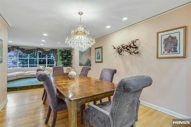 526 Rutland Ave, Teaneck, NJ 07666 - dining room with ornamental molding, a chandelier, baseboards, light wood finished floors, and recessed lighting