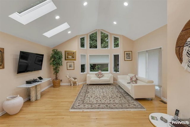 526 Rutland Ave, Teaneck, NJ 07666 - living room featuring a skylight, wood finished floors, recessed lighting, high vaulted ceiling, and baseboards