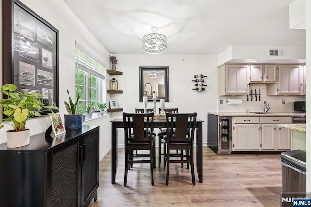 510 Mark Twain Way, Mahwah, NJ 07430 - dining area featuring wine cooler, light wood-style floors, and a chandelier