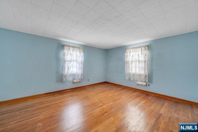 36 Bogert St, Totowa, NJ 07512 - empty room featuring wood finished floors and baseboards
