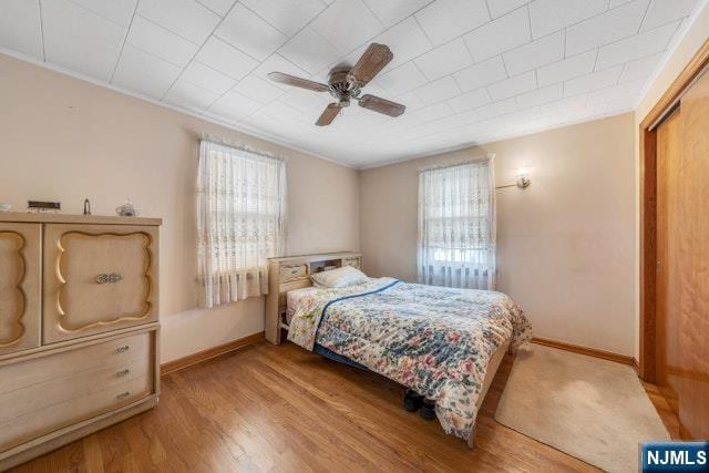 36 Bogert St, Totowa, NJ 07512 - bedroom featuring multiple windows, wood finished floors, baseboards, and crown molding