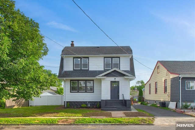 172 Inman Ave, Rahway, NJ 07065 - view of front of home featuring fence, a chimney, and entry steps
