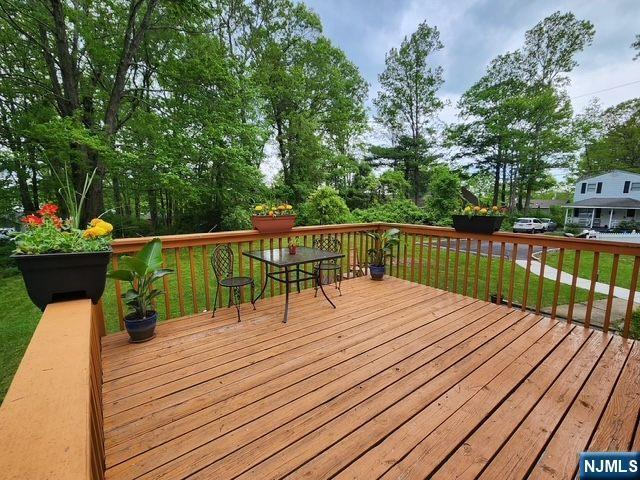 22 Elizabeth Rd, West Milford, NJ 07421 - wooden deck featuring a lawn