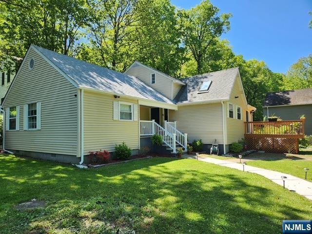 22 Elizabeth Rd, West Milford, NJ 07421 - view of front of house featuring a front lawn, a wooden deck, and crawl space
