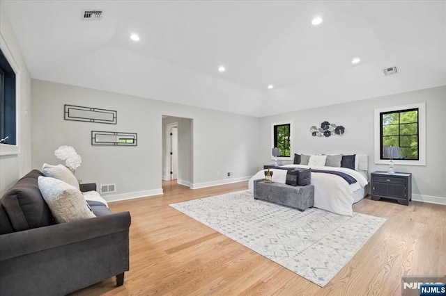 20 Aronow Pl, Mahwah, NJ 07430 - bedroom with multiple windows, light wood-type flooring, vaulted ceiling, baseboards, and recessed lighting