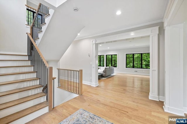 20 Aronow Pl, Mahwah, NJ 07430 - stairs with crown molding, wood finished floors, recessed lighting, and baseboards