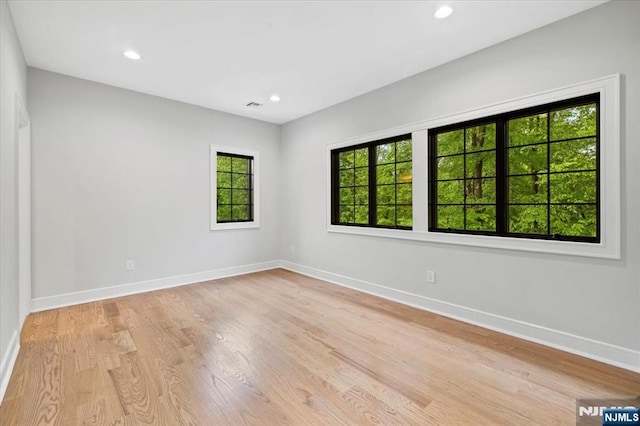 20 Aronow Pl, Mahwah, NJ 07430 - unfurnished room with healthy amount of natural light, baseboards, light wood-type flooring, and recessed lighting