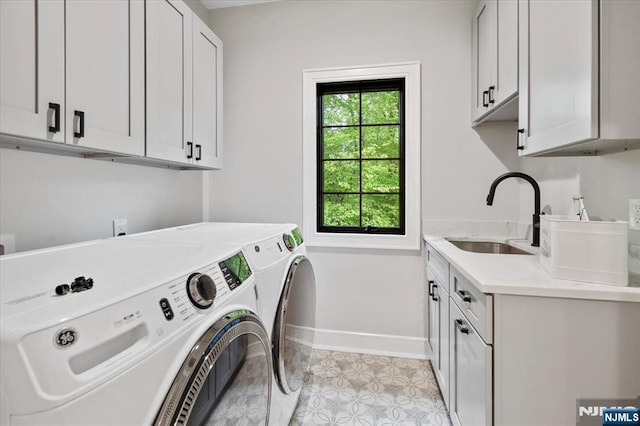 20 Aronow Pl, Mahwah, NJ 07430 - laundry room featuring cabinet space, washing machine and clothes dryer, baseboards, and light tile patterned flooring
