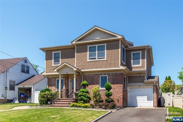 79 Palsa Ave, Elmwood Park, NJ 07407 - view of front of house featuring brick siding, an attached garage, and driveway