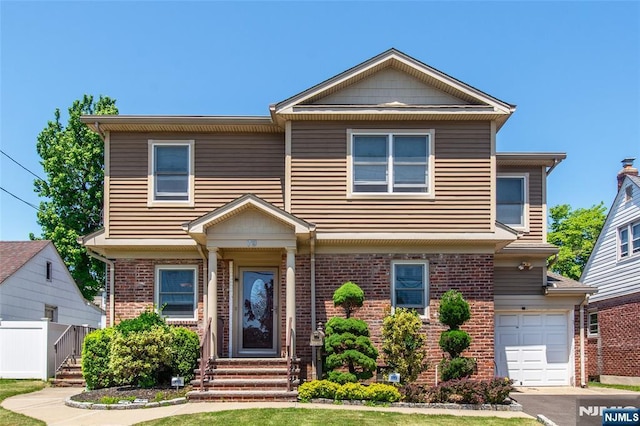 79 Palsa Ave, Elmwood Park, NJ 07407 - view of front facade with brick siding, a garage, and entry steps