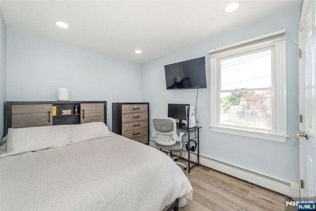 79 Palsa Ave, Elmwood Park, NJ 07407 - bedroom featuring wood finished floors, a baseboard heating unit, and recessed lighting