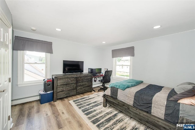 79 Palsa Ave, Elmwood Park, NJ 07407 - bedroom with a baseboard heating unit, wood finished floors, a baseboard radiator, and recessed lighting