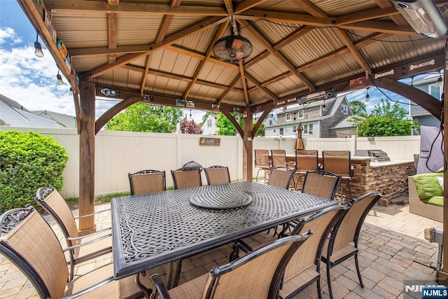 79 Palsa Ave, Elmwood Park, NJ 07407 - fenced backyard with a gazebo, outdoor dining area, an outdoor kitchen, and a patio area