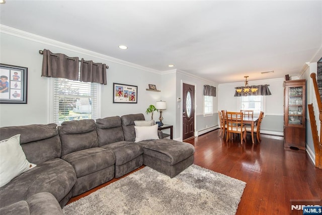 79 Palsa Ave, Elmwood Park, NJ 07407 - living area featuring crown molding, a chandelier, baseboard heating, dark wood finished floors, and healthy amount of natural light