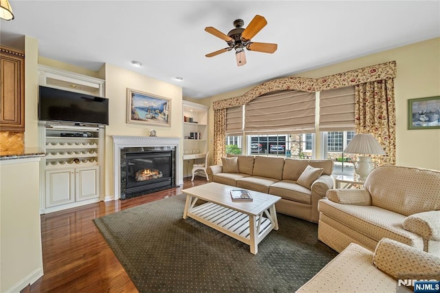 49 Quarry Dr, Woodland Park, NJ 07424 - living area featuring a ceiling fan, dark wood-style floors, and a fireplace with flush hearth
