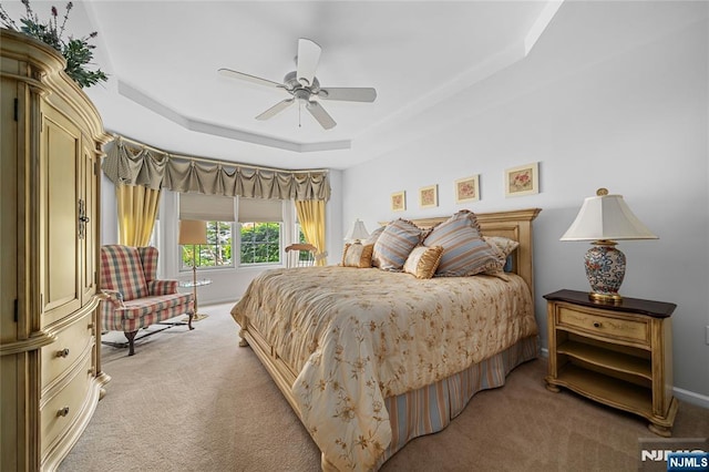 49 Quarry Dr, Woodland Park, NJ 07424 - bedroom with light colored carpet, a raised ceiling, and ceiling fan