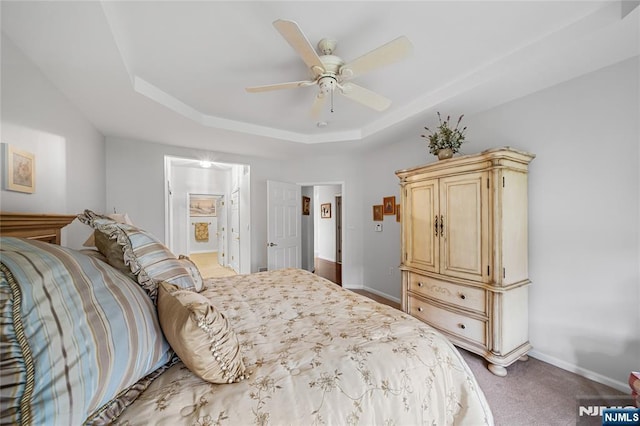 49 Quarry Dr, Woodland Park, NJ 07424 - carpeted bedroom with a tray ceiling, a ceiling fan, ensuite bathroom, and baseboards