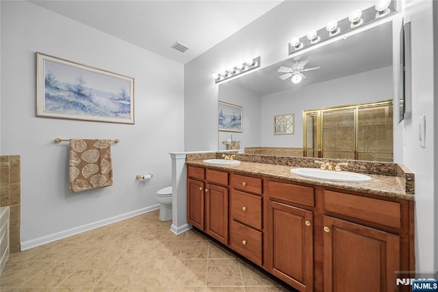 49 Quarry Dr, Woodland Park, NJ 07424 - bathroom with double vanity, a shower stall, toilet, baseboards, and a bath