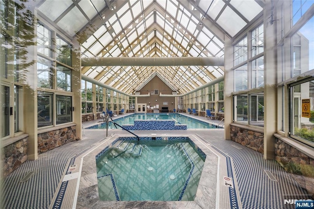 49 Quarry Dr, Woodland Park, NJ 07424 - indoor pool with a hot tub and a patio area