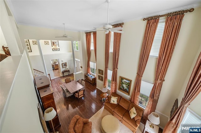 49 Quarry Dr, Woodland Park, NJ 07424 - living room featuring wood finished floors, ornamental molding, a ceiling fan, and baseboards