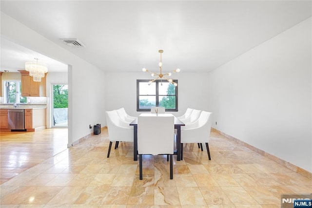 47 Venna Ave, North Haledon, NJ 07508 - dining room with a chandelier and baseboards