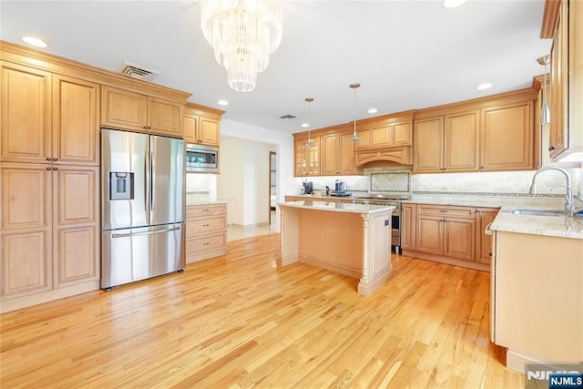 47 Venna Ave, North Haledon, NJ 07508 - kitchen with stainless steel appliances, a sink, light wood-style floors, recessed lighting, and a kitchen island