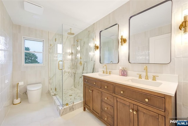 47 Venna Ave, North Haledon, NJ 07508 - full bathroom with tile walls, a marble finish shower, double vanity, toilet, and tile patterned floors