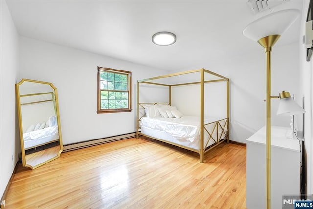 47 Venna Ave, North Haledon, NJ 07508 - bedroom with a baseboard radiator and light wood-type flooring