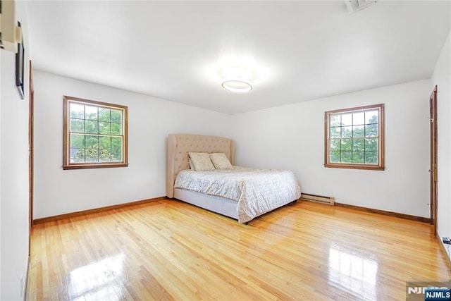 47 Venna Ave, North Haledon, NJ 07508 - bedroom featuring a baseboard radiator, wood finished floors, and baseboards
