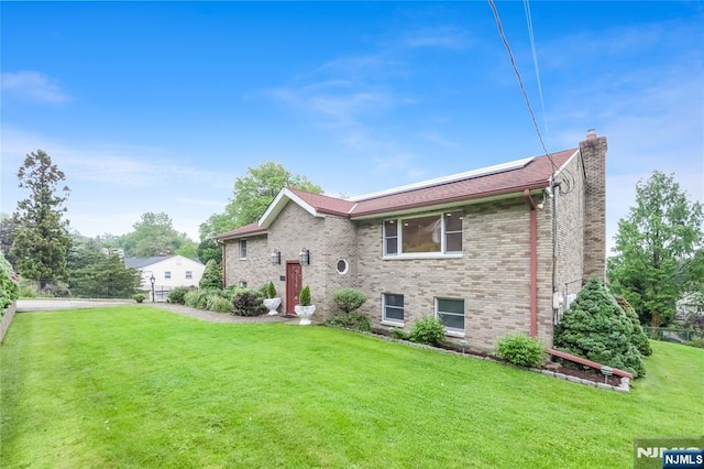 47 Venna Ave, North Haledon, NJ 07508 - tri-level home with a chimney and brick siding