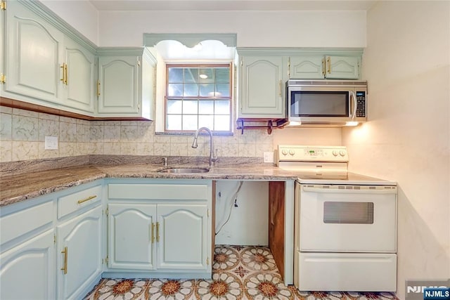 47 Venna Ave, North Haledon, NJ 07508 - kitchen featuring stainless steel microwave, white range with electric cooktop, a sink, and tasteful backsplash
