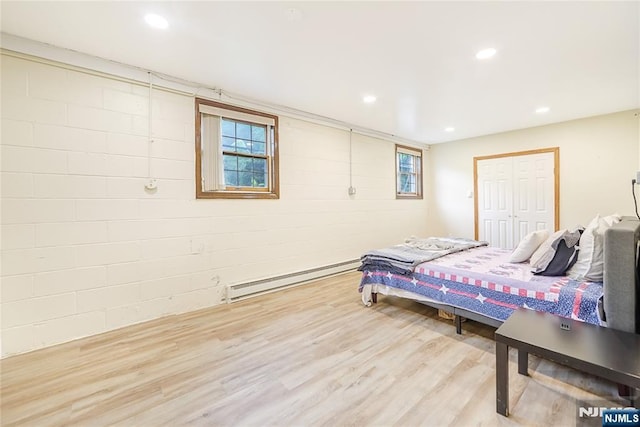 47 Venna Ave, North Haledon, NJ 07508 - bedroom with a baseboard heating unit, wood finished floors, recessed lighting, and a closet