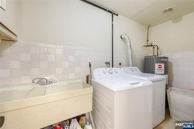47 Venna Ave, North Haledon, NJ 07508 - washroom with tile walls, cabinet space, washer and clothes dryer, and a wainscoted wall