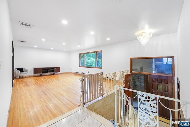 47 Venna Ave, North Haledon, NJ 07508 - living room featuring recessed lighting, a chandelier, wood finished floors, and a baseboard radiator