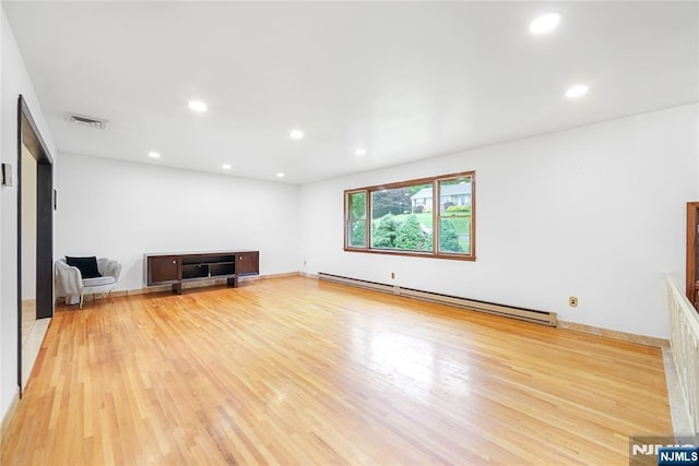 47 Venna Ave, North Haledon, NJ 07508 - unfurnished living room featuring baseboard heating, light wood-type flooring, and recessed lighting