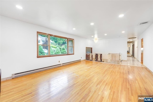47 Venna Ave, North Haledon, NJ 07508 - unfurnished room featuring a baseboard heating unit, light wood finished floors, and recessed lighting