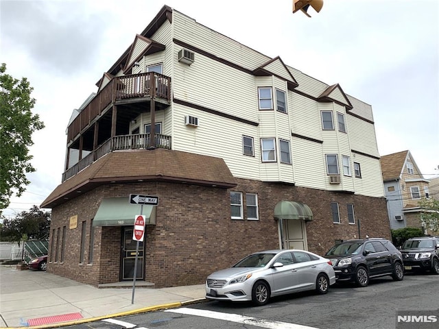 116 W 19th St Unit 1A, Bayonne, NJ 07002 - view of building exterior with a wall mounted AC