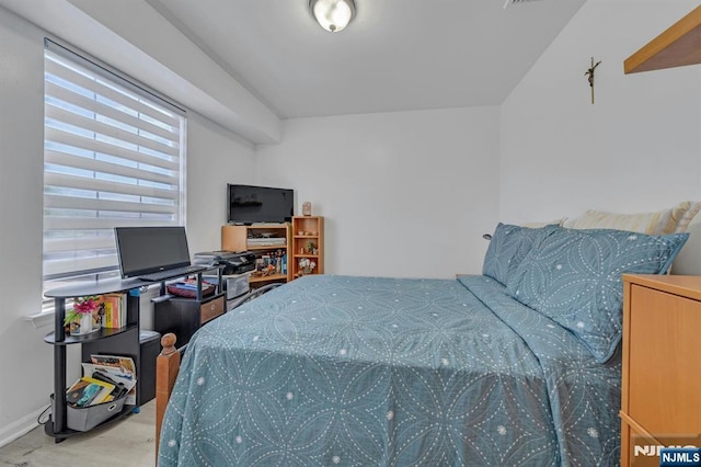 bedroom featuring baseboards