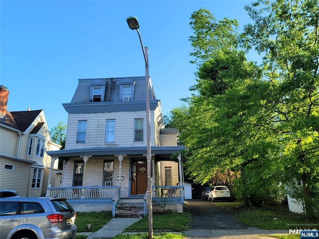 79 Norman St, East Orange, NJ 07017 - second empire-style home featuring covered porch and mansard roof
