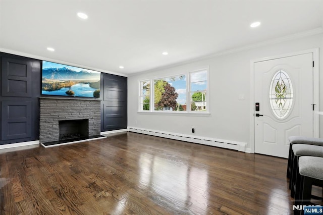 8 Oak St, Netcong Borough, NJ 07857 - unfurnished living room with baseboard heating, ornamental molding, a stone fireplace, recessed lighting, and wood finished floors