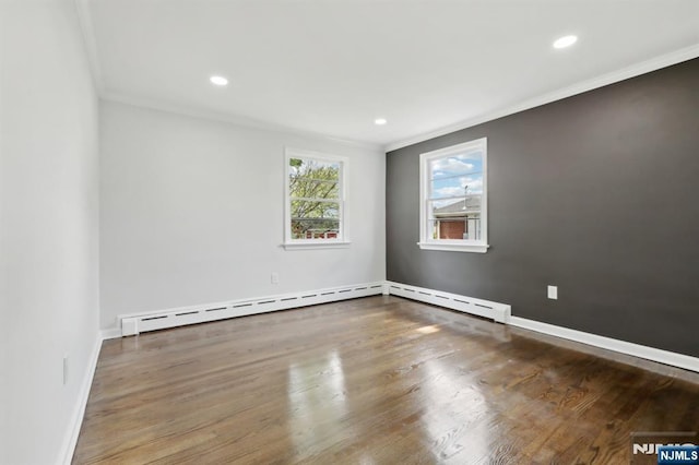 8 Oak St, Netcong Borough, NJ 07857 - empty room featuring crown molding, a baseboard heating unit, wood finished floors, recessed lighting, and baseboards