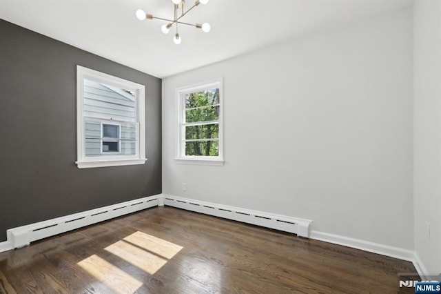 8 Oak St, Netcong Borough, NJ 07857 - empty room with a chandelier, wood finished floors, baseboards, and a baseboard heating unit