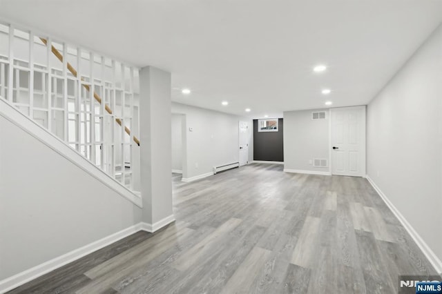 8 Oak St, Netcong Borough, NJ 07857 - unfurnished living room with a baseboard radiator, stairway, recessed lighting, wood finished floors, and baseboards