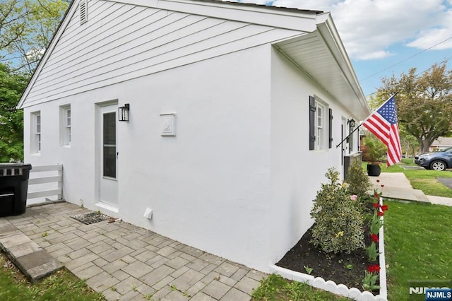 8 Oak St, Netcong Borough, NJ 07857 - view of side of home with stucco siding and a patio area
