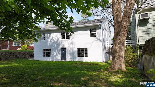 8 Oak St, Netcong Borough, NJ 07857 - back of house featuring stucco siding and a yard