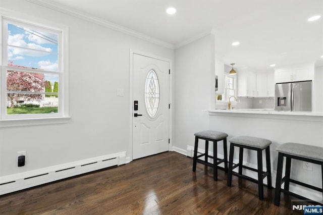 8 Oak St, Netcong Borough, NJ 07857 - foyer entrance featuring a baseboard heating unit, dark wood-style flooring, ornamental molding, recessed lighting, and baseboards