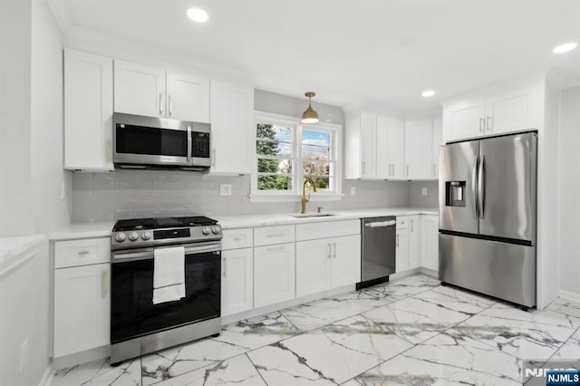 8 Oak St, Netcong Borough, NJ 07857 - kitchen with stainless steel appliances, a sink, recessed lighting, light countertops, and light marble finish flooring