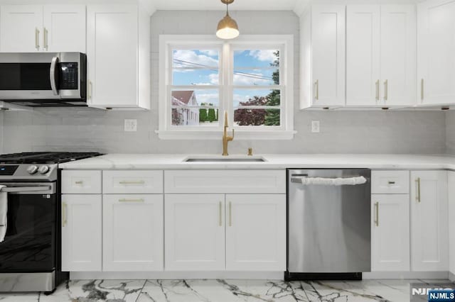 8 Oak St, Netcong Borough, NJ 07857 - kitchen featuring stainless steel appliances, a sink, light marble finish flooring, white cabinets, and decorative backsplash