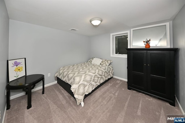 carpeted bedroom with baseboards