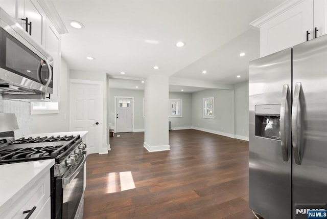 240 Berry St, Hackensack, NJ 07601 - kitchen featuring stainless steel appliances, decorative backsplash, dark wood-style flooring, white cabinetry, and recessed lighting